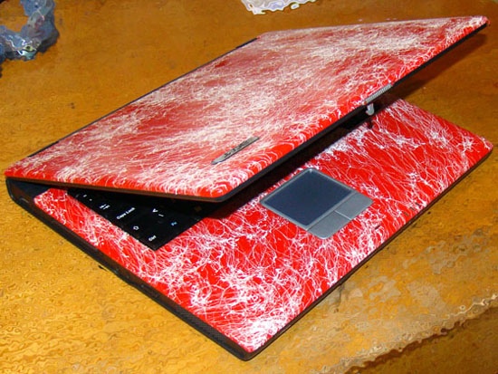 The painted laptop in a semi-closed state