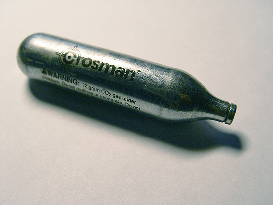 A typical Powerlet 12 gram CO₂ cartridge from Crosman