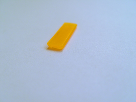 A small piece of plastic from the ruler